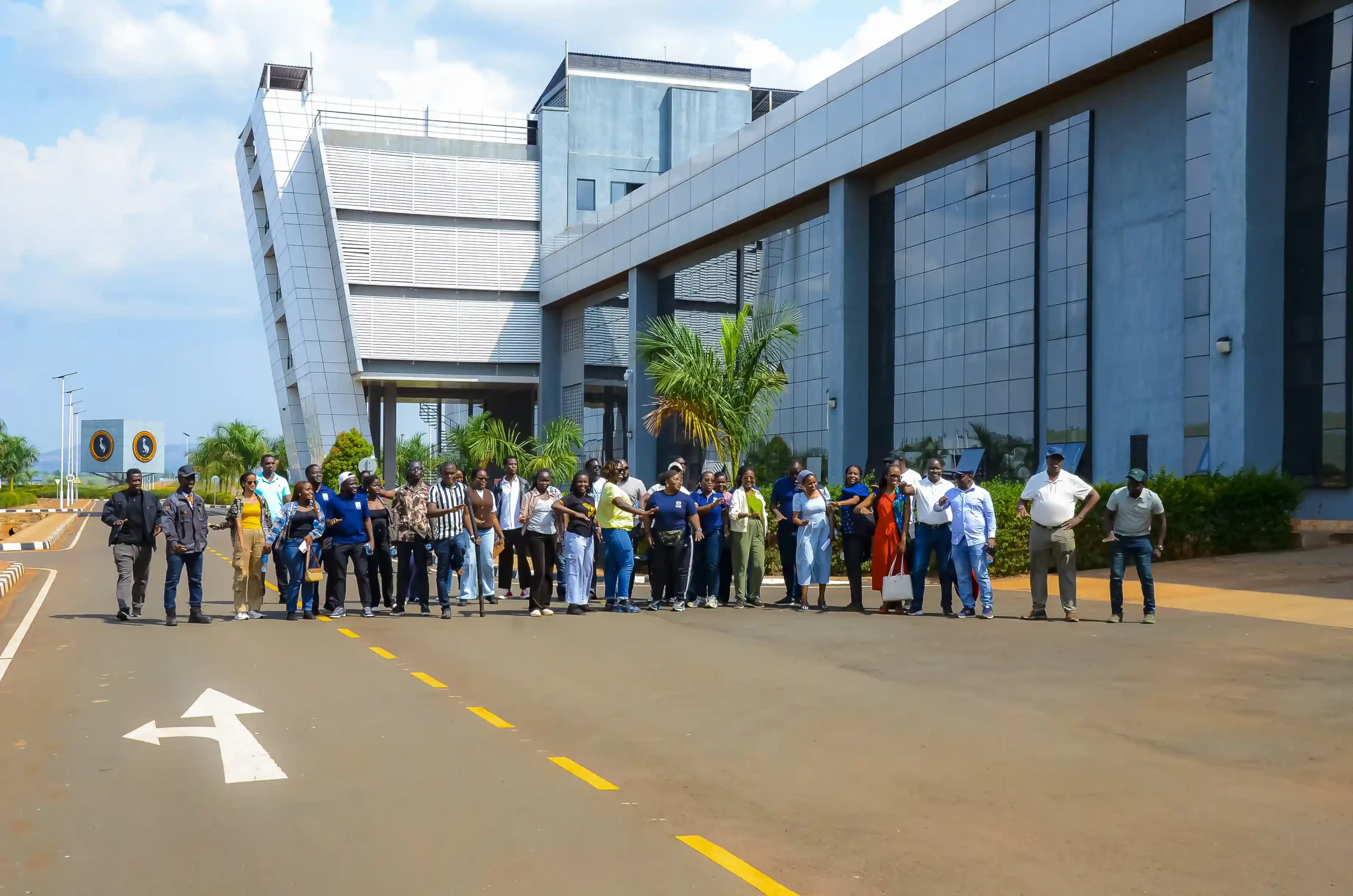group of chevening professionals outside kiira motots office